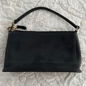 Black leather Coach wristlet.